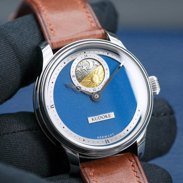 Front view of Kudoke 2 "Deep Blue" Limited Edition in gloved hand