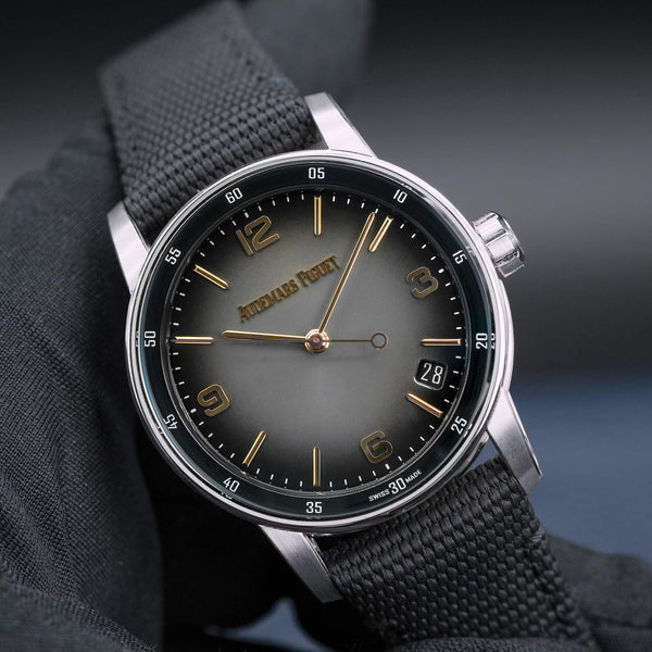 Front view of Audemars Piguet Code 11.59 15210CR Grey Dial in gloved hand
