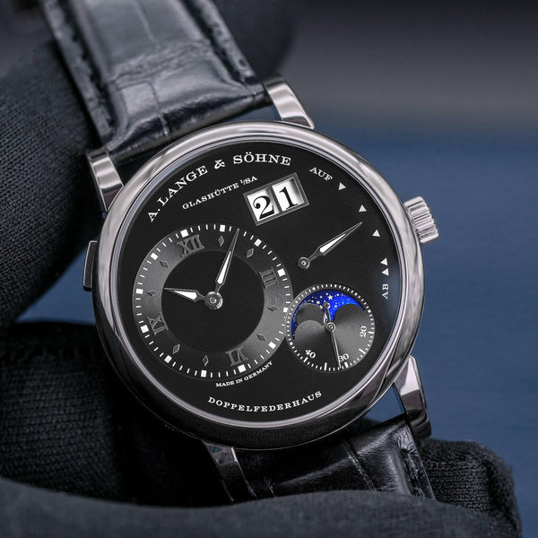 Front view of A. Lange & Sohne Lange 1 192.029 Moon Phase in gloved hand