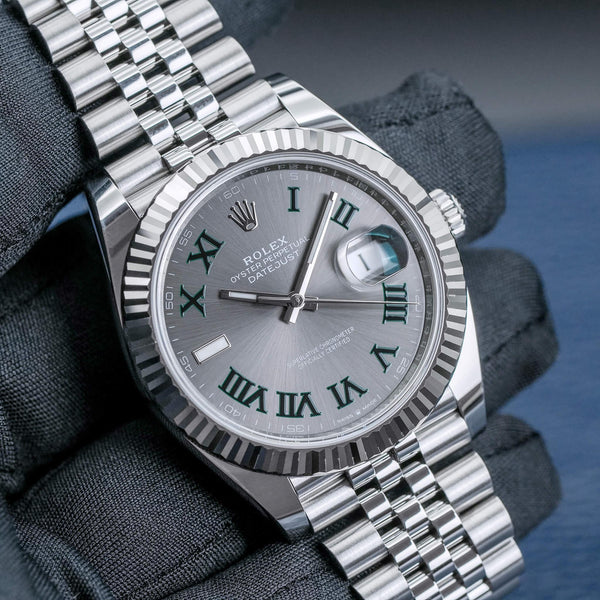 Front view of Rolex Datejust Wimbledon 126334 Slate Dial in gloved hand