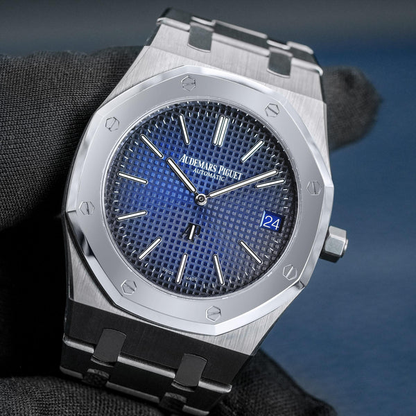 Front view of Audemars Piguet Royal Oak 15202IP "Jumbo" Extra Thin Blue in gloved hand