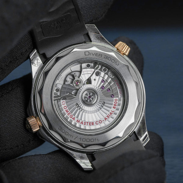 Caseback of Omega Seamaster Diver 300M Black Dial Sedna Gold showing movement