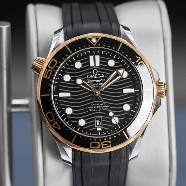 Slight angled view of Omega Seamaster Diver 300M Black Dial Sedna Gold