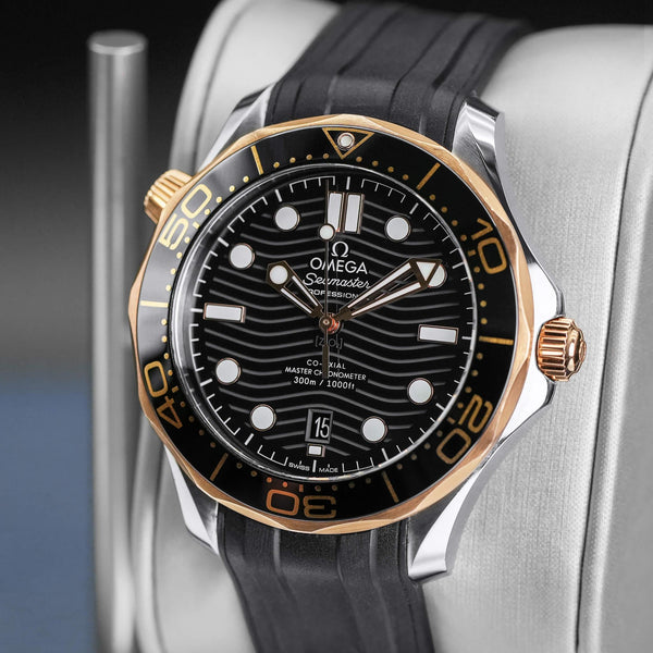Close-up opposing view of Omega Seamaster Diver 300M Black Dial Sedna Gold
