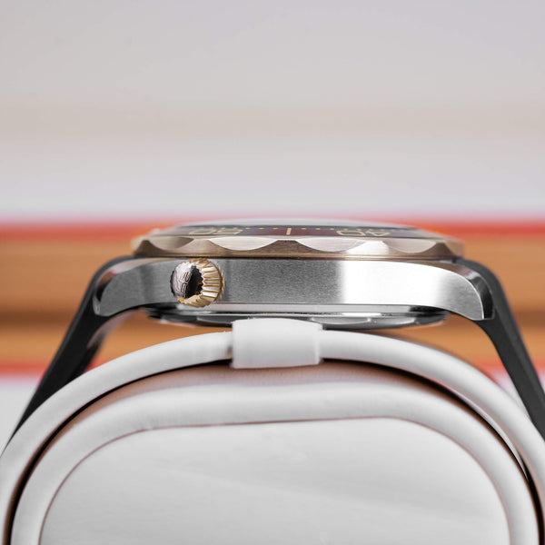 Opposite side view of Omega Seamaster Diver 300M Black Dial Sedna Gold