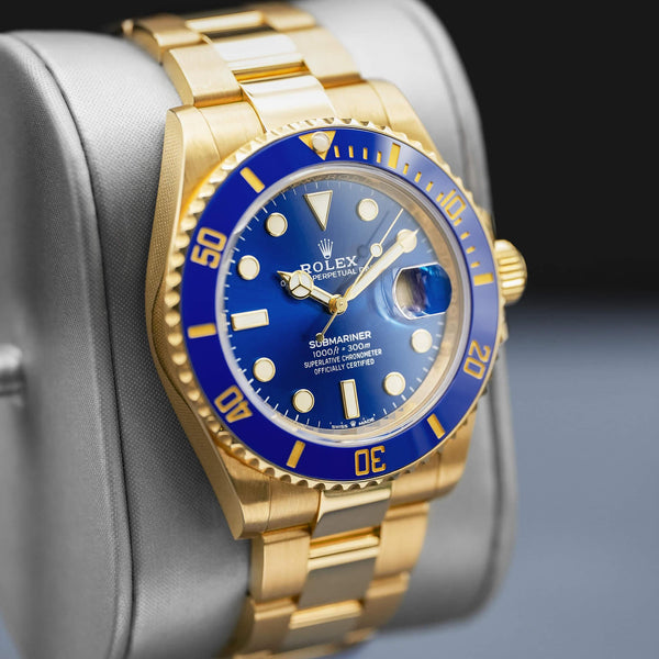 Angled view with reflection of Rolex Submariner "Bluesy" 126618LB Yellow Gold