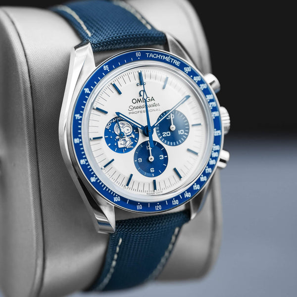 Angled view with reflection of Omega Speedmaster “Silver Snoopy Award” 50th Anniversary 2022