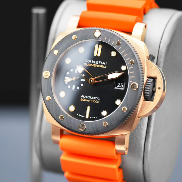 Angled opposing view with reflection of Panerai Submersible QuarantaQuattro Goldtech Orocarbo PAM02070