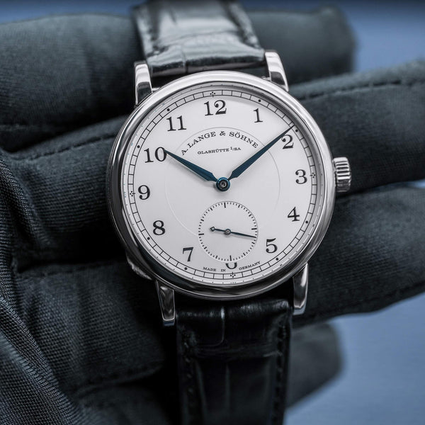 Front view of A. Lange & Sohne 1815 235.049 Silver Dial in gloved hand
