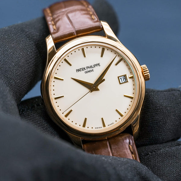 Front view of Patek Philippe Calatrava 5227J Ivory Dial in gloved hand