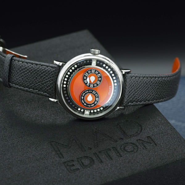 Angled macro view of MB&F M.A.D 2 Orange Dial