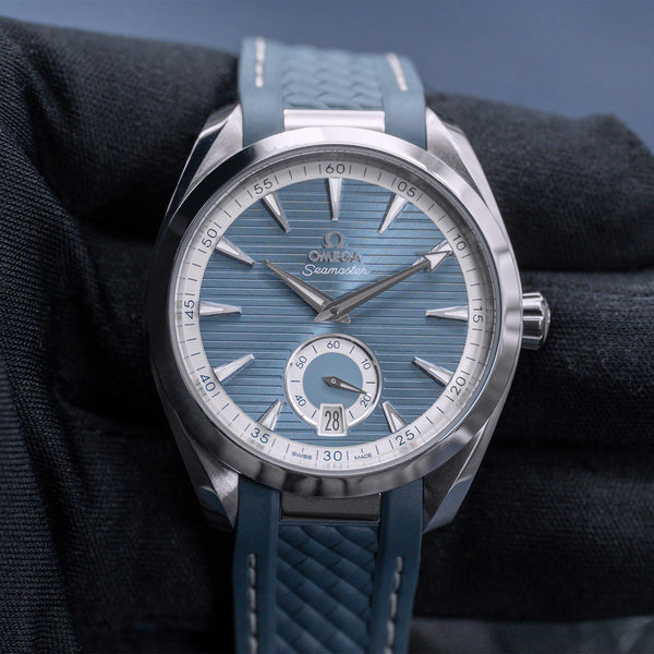 Front view of Omega Seamaster Aqua Terra Blue Dial on gloved hand