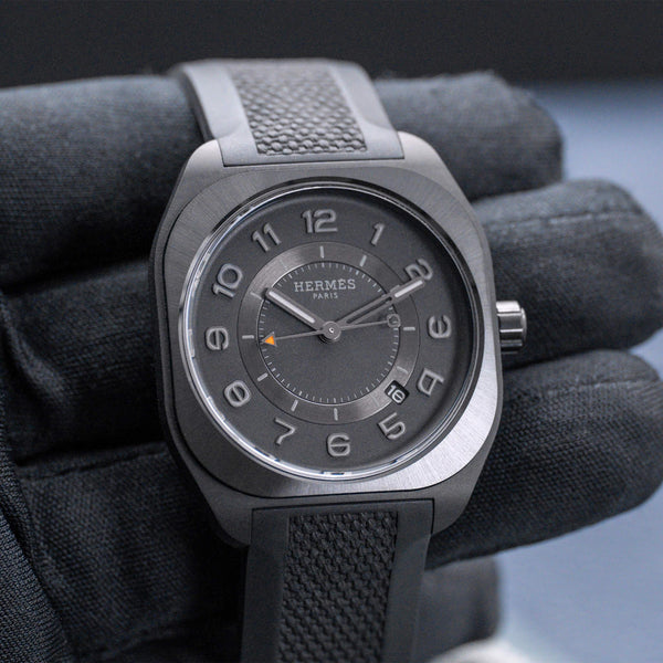 Front view of Hermes H08 SP1.742 in gloved hand