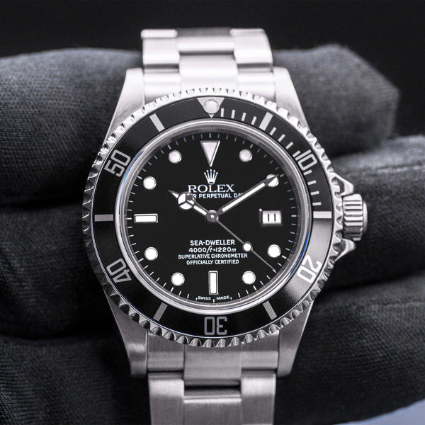 Front view of Rolex Sea-Dweller 16600 Black Dial in gloved hand