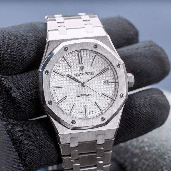 Front view of Audemars Piguet Royal Oak 15400ST White Dial in gloved hand