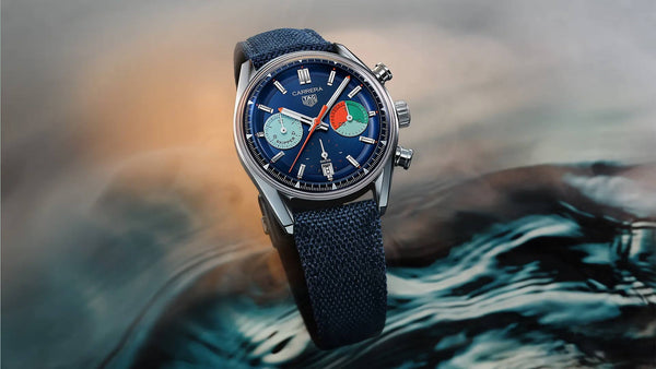 TAG Heuer Carrera Skipper chronograph with blue dial and fabric strap, positioned above water surface