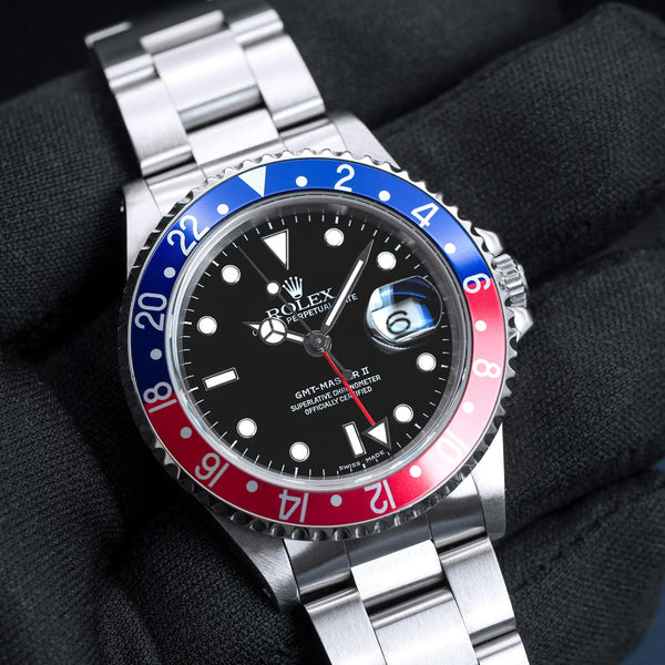 Front view of Rolex GMT Master II 16710 “Pepsi” in gloved hand