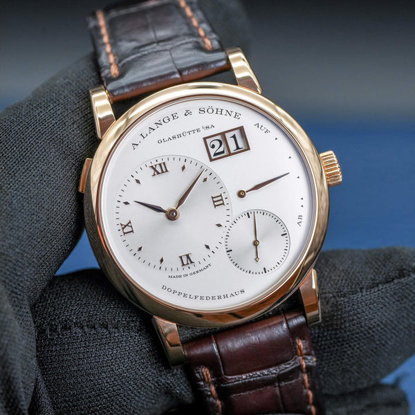 Front view A. Lange & Sohne Lange 1 191.032 Silver Dial in gloved hand