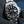 Front view of Rolex GMT-Master II 116710LN Green Arrow in gloved hand
