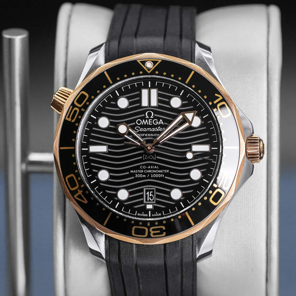 Central view of Omega Seamaster Diver 300M Black Dial Sedna Gold 