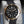 Close-up angled view of Omega Seamaster Diver 300M Black Dial Sedna Gold 