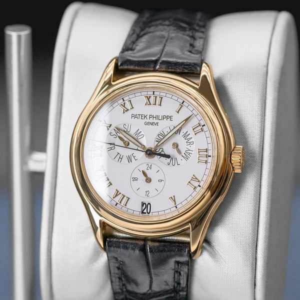 Angled opposing view with reflection of Patek Philippe Annual Calendar 5035J Yellow Gold 