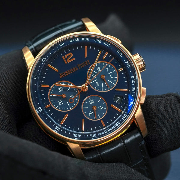 Front view of Audemars Piguet Code 11.59 Chronograph 26393OR Blue Dial in gloved hand