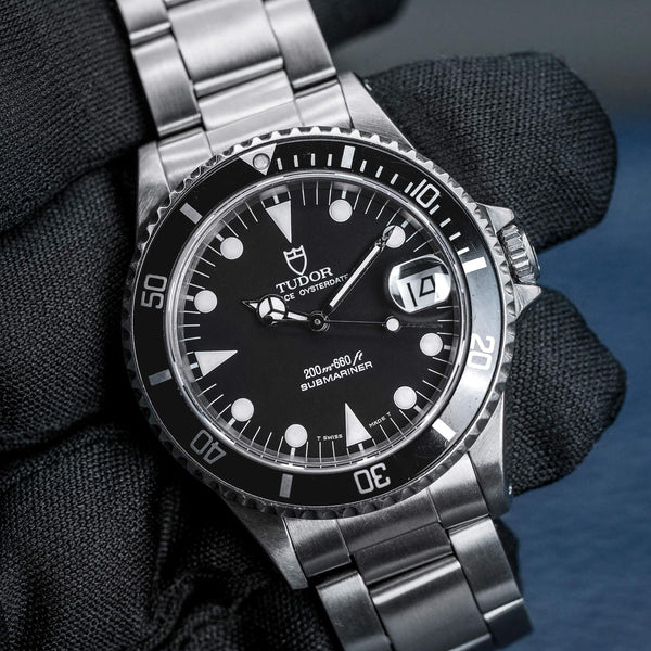 Front view of Tudor Submariner 75090 Black Dial in gloved hand