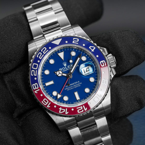 Front view of Rolex GMT-Master II “Pepsi” 126719BLRO White Gold in gloved hand