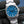 Front view of Rolex Oyster Perpetual 134300 Blue Dial in gloved hand