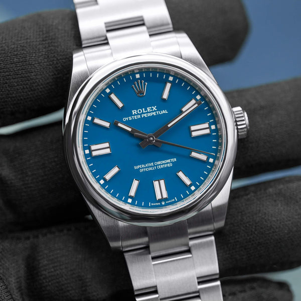 Front view of Rolex Oyster Perpetual 134300 Blue Dial in gloved hand
