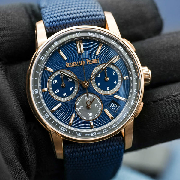 Front view of Audemars Piguet Code 11.59 Chronograph 26393OR Rose Gold in gloved hand
