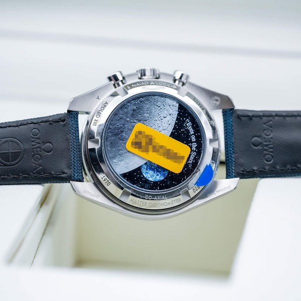Caseback of Omega Speedmaster “Silver Snoopy Award” 50th Anniversary showing design