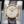 Slight angled view showing crown on Parmigiani Fleurier Tonda 1950 Rose Gold White Dial
