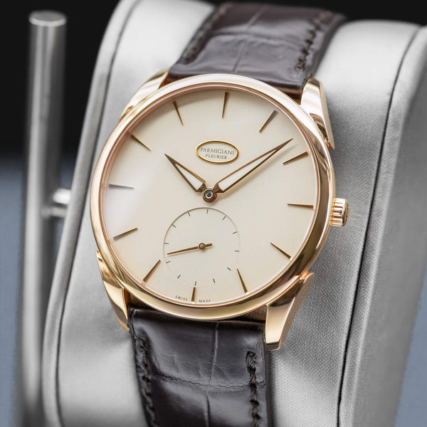 Angled opposing view with reflection of Parmigiani Fleurier Tonda 1950 Rose Gold White Dial