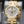 Slight angled view showing crown on Vacheron Constantin Overseas 49150 Yellow Gold White Dial