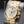 Angled opposing view with reflection of Vacheron Constantin Overseas 49150 Yellow Gold White Dial