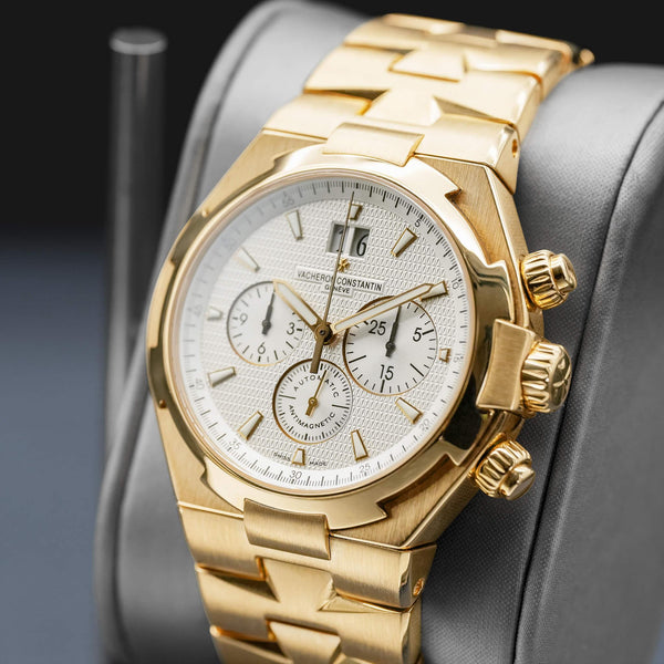 Angled opposing view with reflection of Vacheron Constantin Overseas 49150 Yellow Gold White Dial
