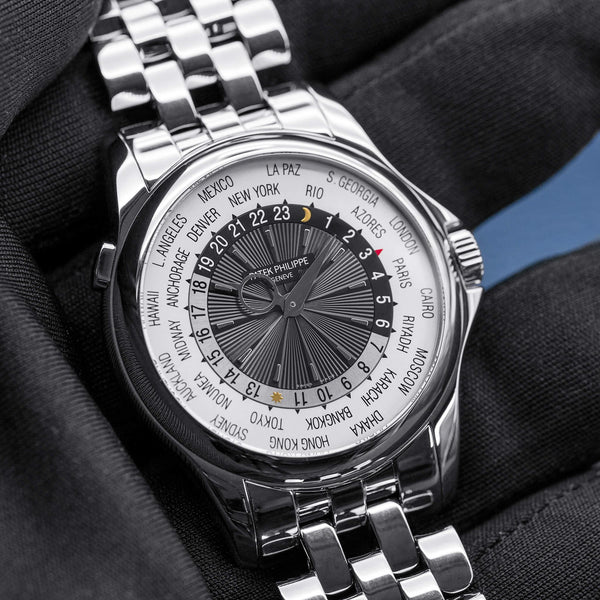 Front view of Patek Philippe Complications World Time 5130/1G  in gloved hand