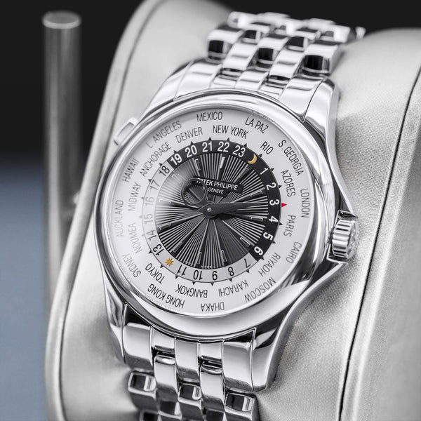 Angled opposing view with reflection of Patek Philippe Complications World Time 5130/1G