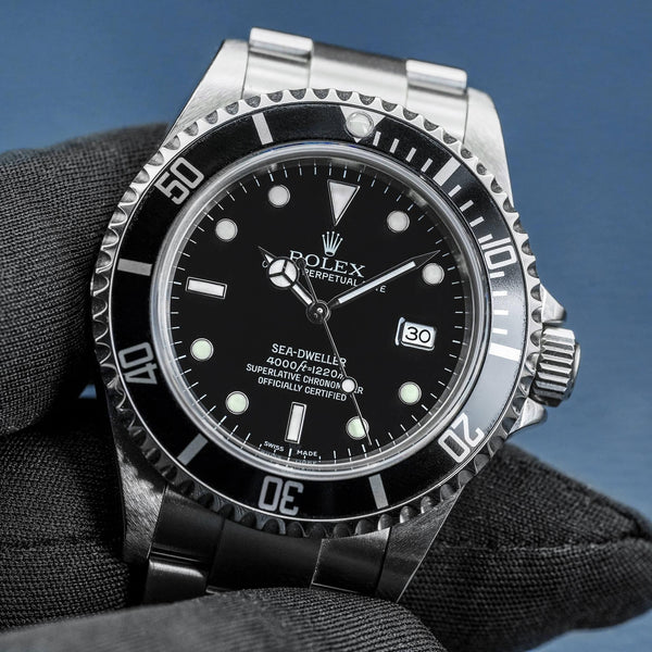 Front view of Rolex Sea-Dweller 16600 Black Dial in gloved hand