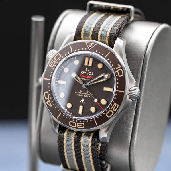 Angled opposing view with reflection of Omega Seamaster Diver 300M No Time To Die 007 Edition