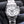 Front view of Rolex Cosmograph Daytona 116520 White Dial in gloved hand