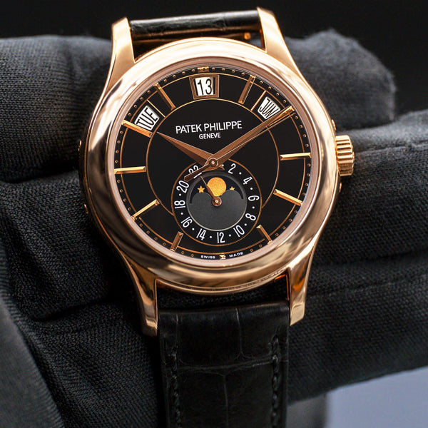 Front view of Patek Philippe Annual Calendar 5205R Rose Gold in gloved hand