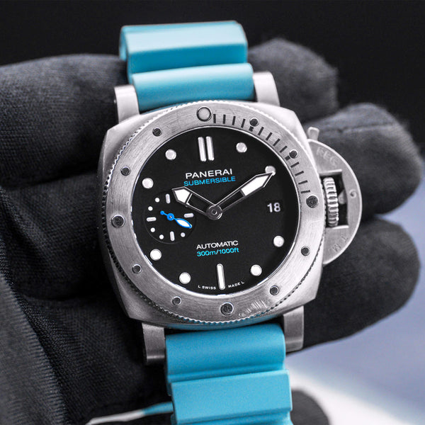 Front view of Panerai Submersible PAM02973 Black Dial in gloved hand