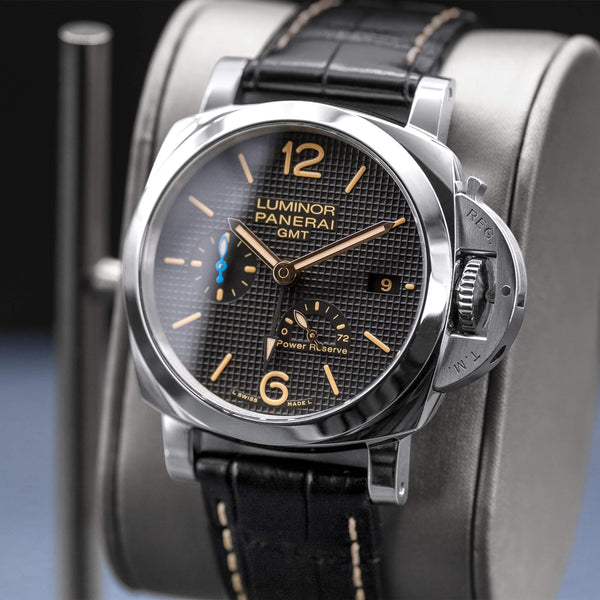 Angled opposing view with reflection of Panerai Luminor 1950 3 Days GMT PAM01537 Black Dial