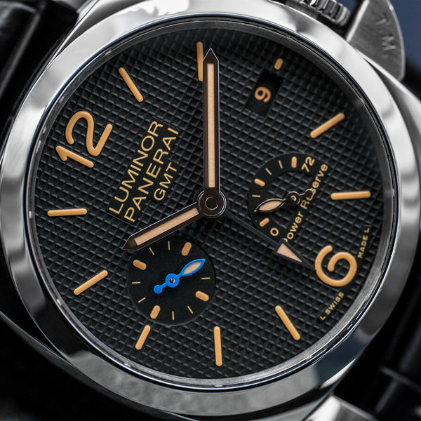 Angled macro view of Panerai Luminor 1950 3 Days GMT PAM01537 Black Dial 