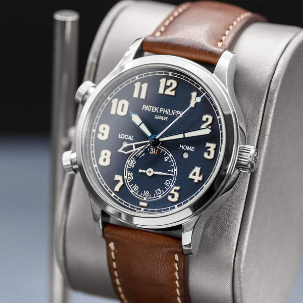 Angled opposing view with reflection of Patek Philippe Calatrava Travel Time 5524G Blue Dial