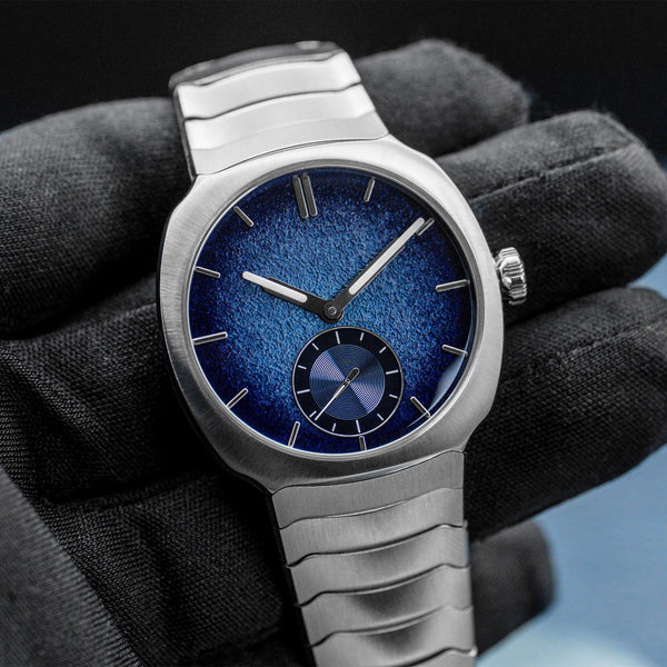 Front view of H.Moser & Cie Streamliner Blue Enamel 6500-1200 in gloved hand