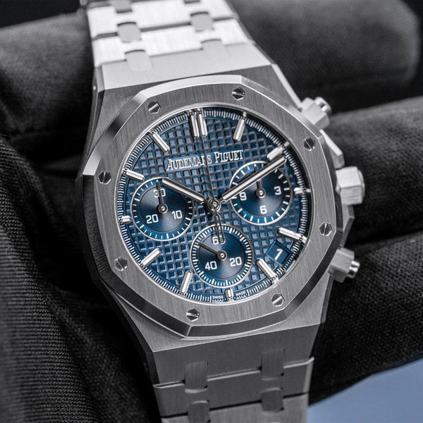 Front view of Audemars Piguet Royal Oak Chrono 26240ST Blue Dial in gloved hand